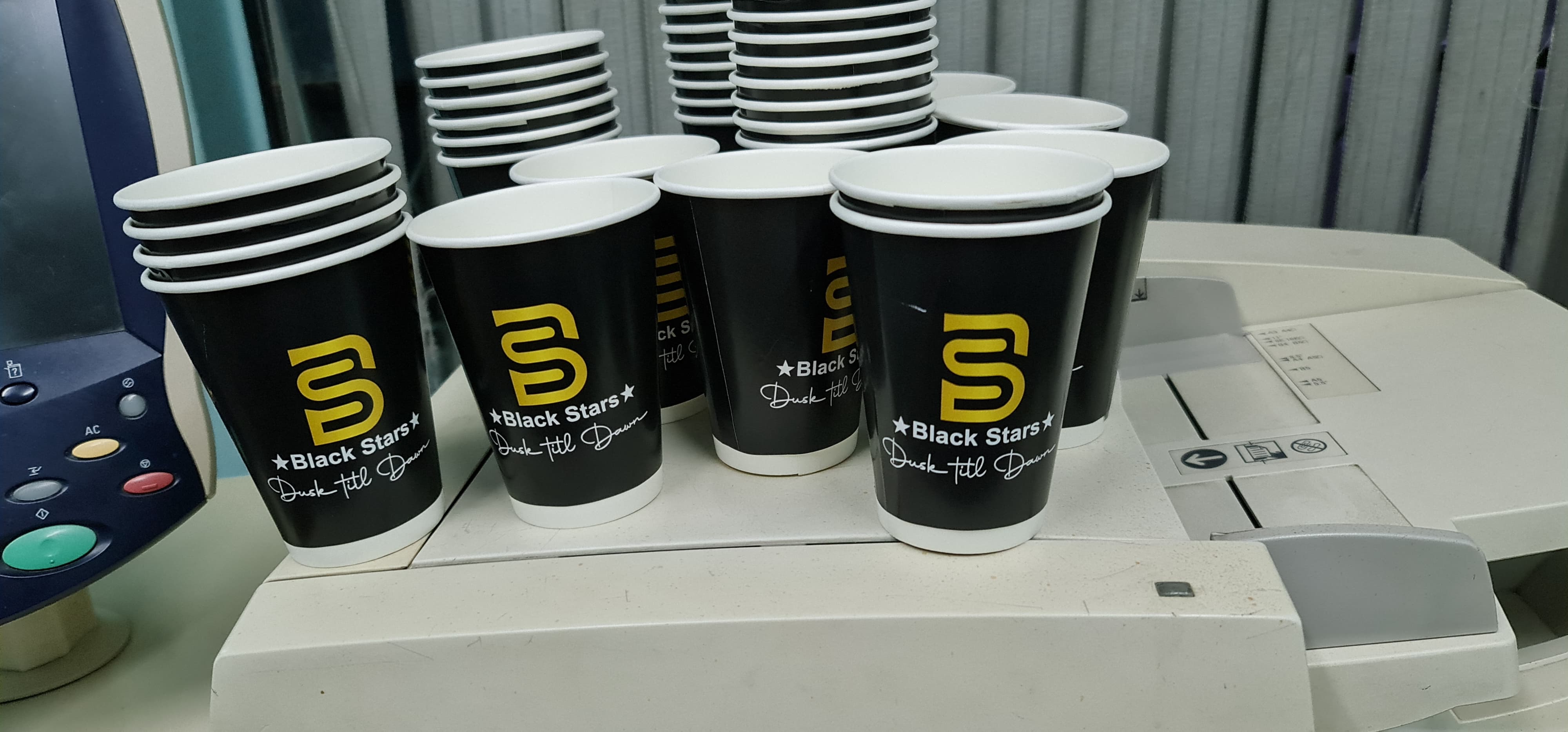 Black Stars branded paper cups
